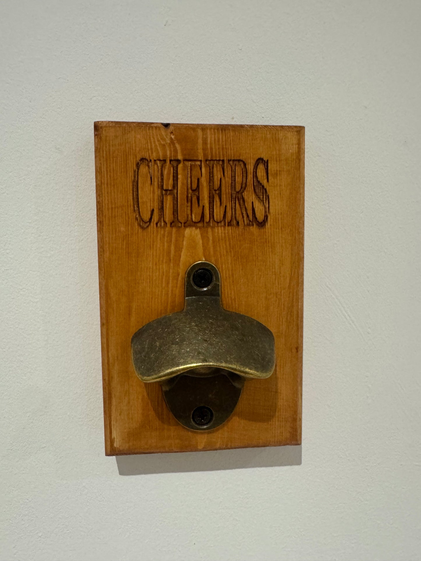 A teak stain bottle opener - Cheers