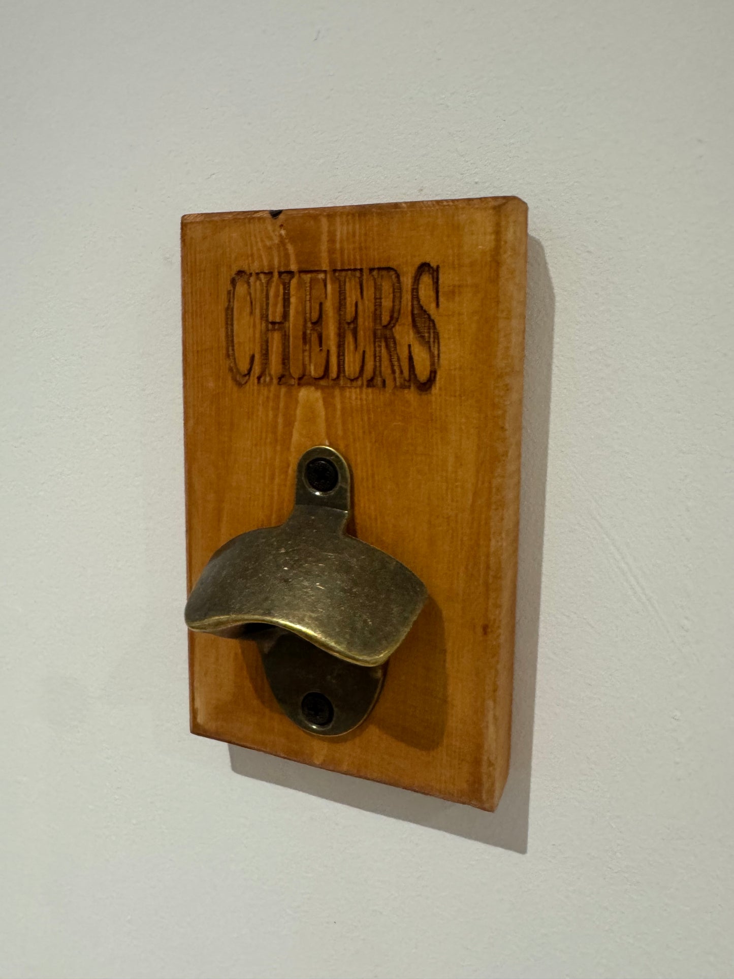 A teak stain bottle opener - Cheers