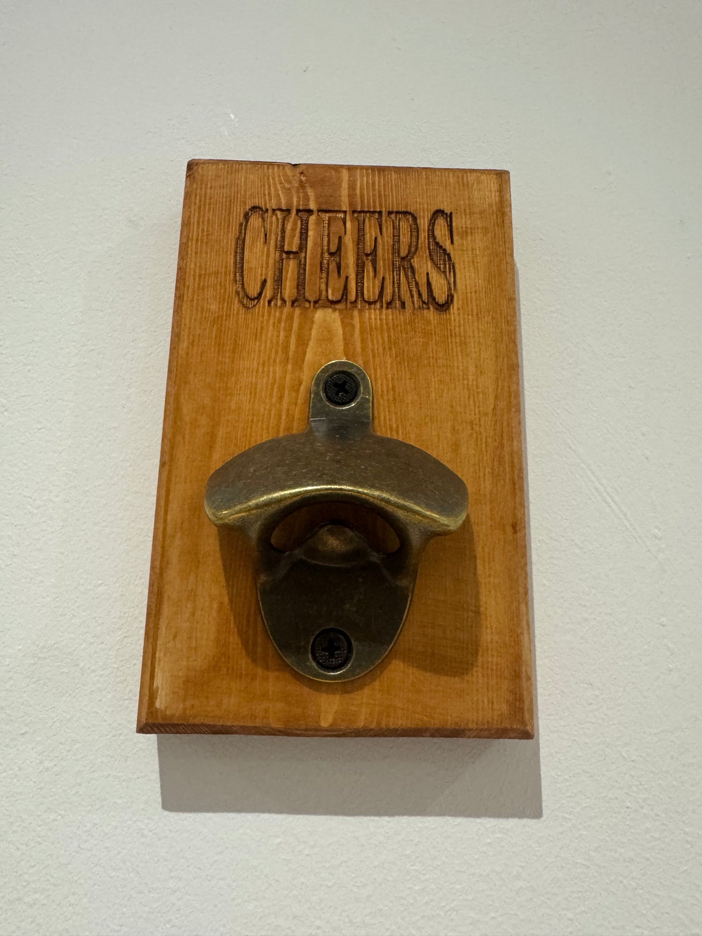 A teak stain bottle opener - Cheers