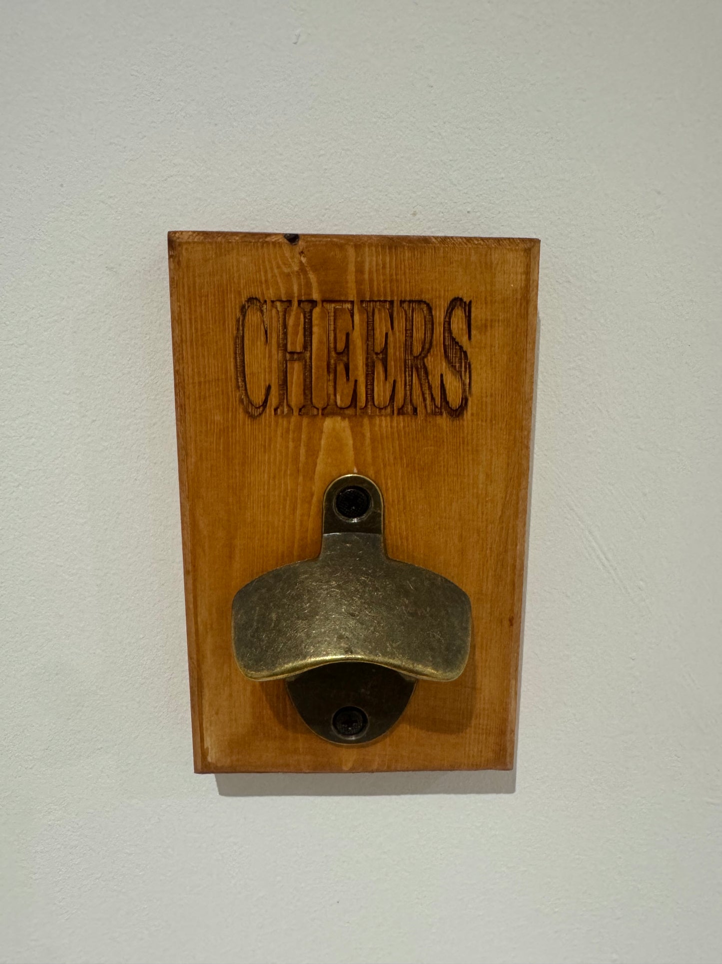 A teak stain bottle opener - Cheers